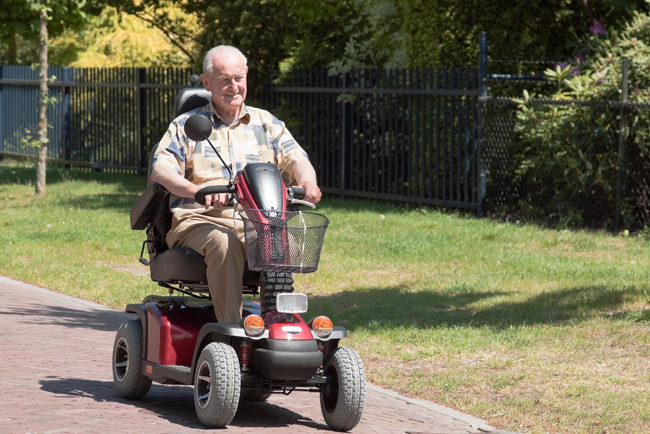 Man using a mobility scooter.